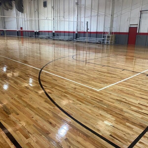 Shiny new hardwood basketball court floor.