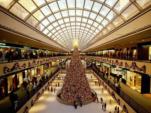 Ice-at-the-Galleria-Houston-Texas Christmas tree in a decorated mall.
