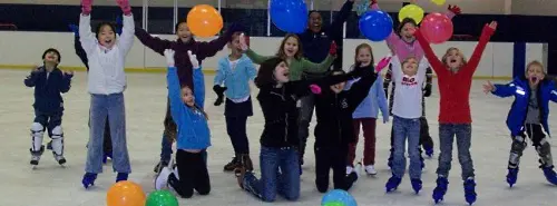 * Kids ice skating with balloons.