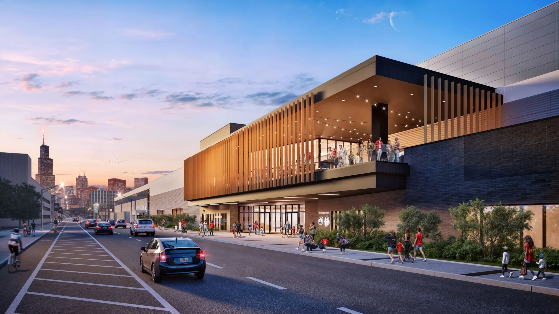 Modern building with glass facade at sunset.